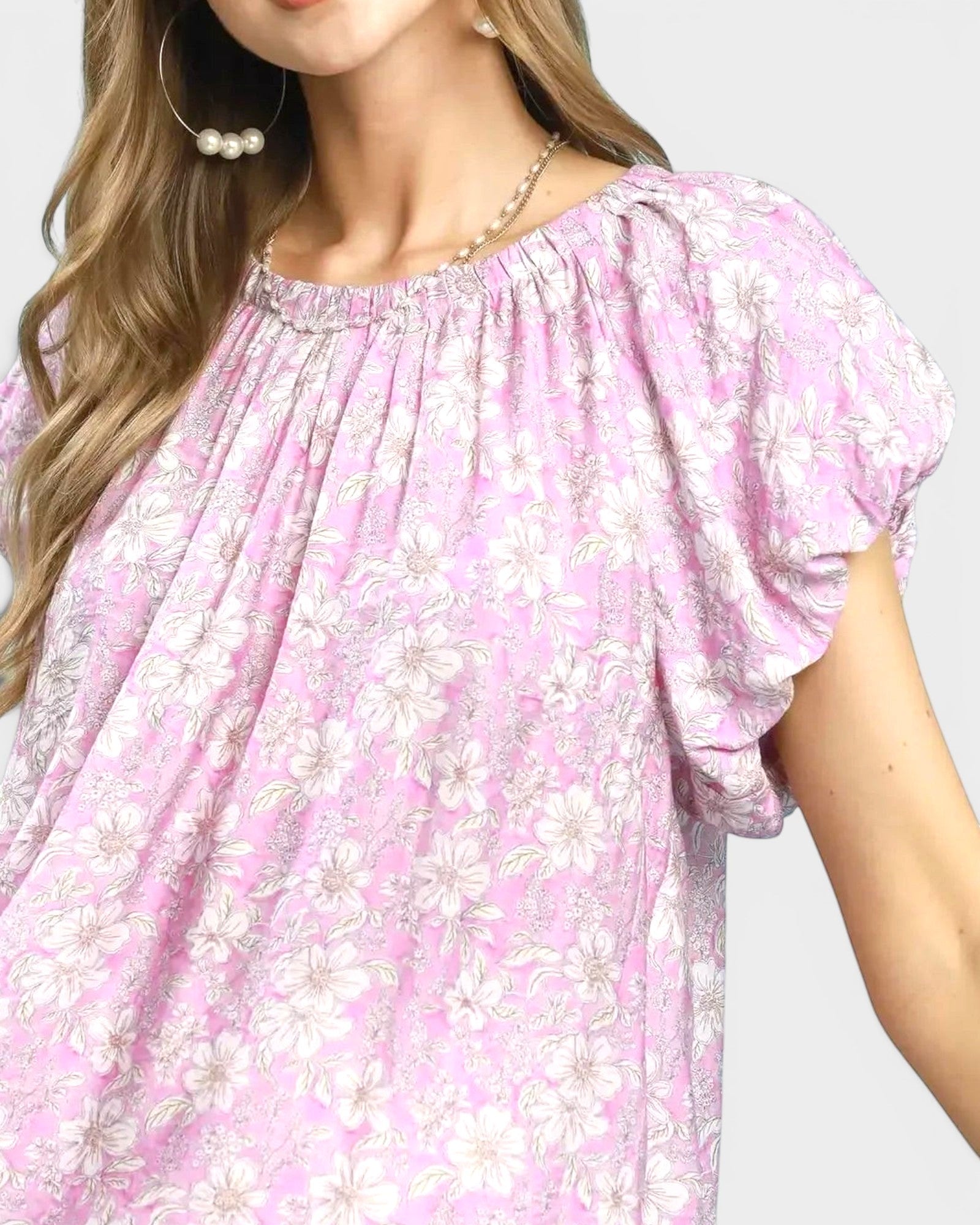 Beach Rose Co. pink floral print blouse with puff sleeves, gathered neckline, and back keyhole detail. Made of rayon and nylon.