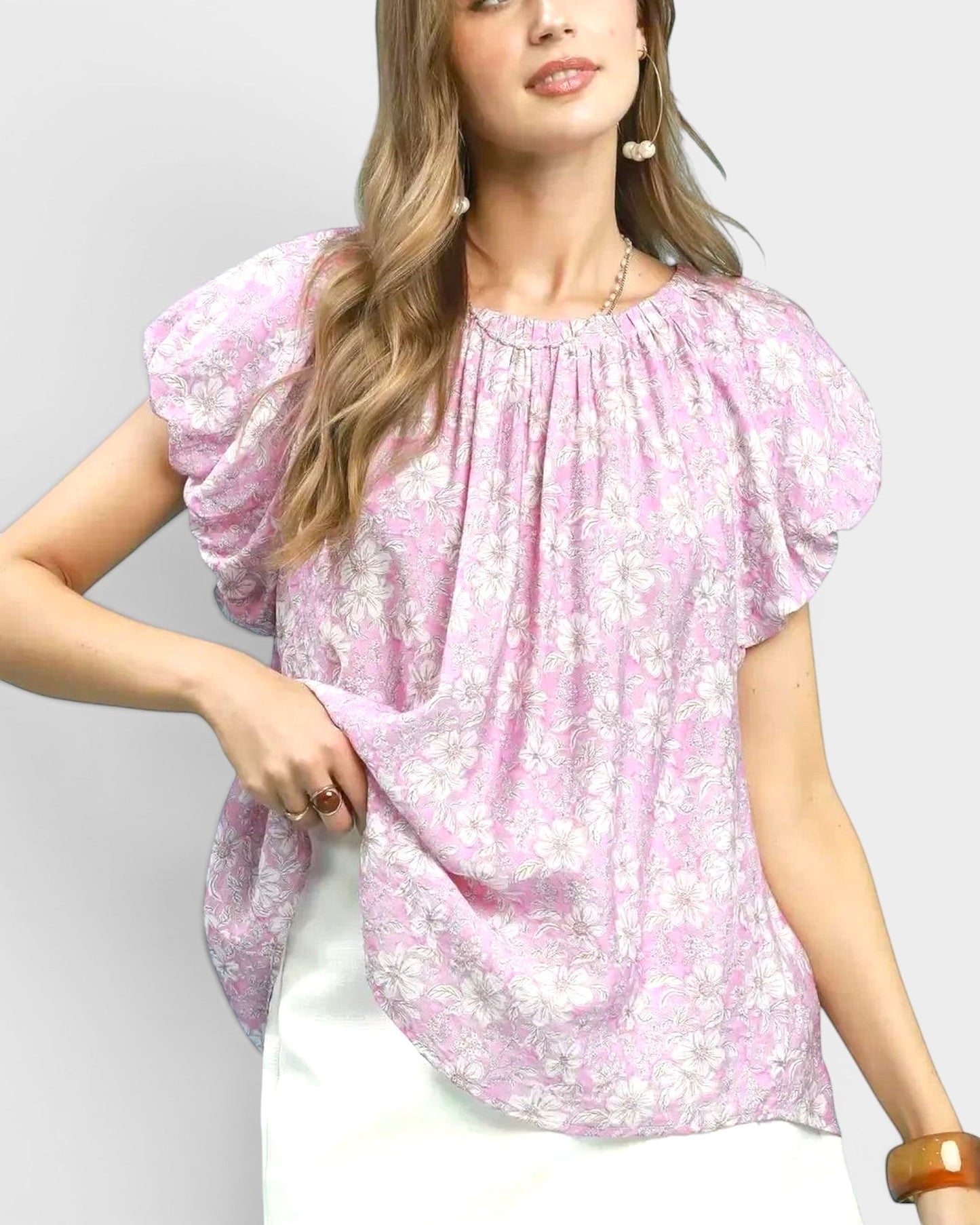 Beach Rose Co. pink floral print blouse with puff sleeves, gathered neckline, and back keyhole detail. Made of rayon and nylon.
