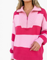 Beach Rose Co. pink and fuchsia striped knit sweater featuring a ribbed half-zip collar and relaxed balloon sleeves.