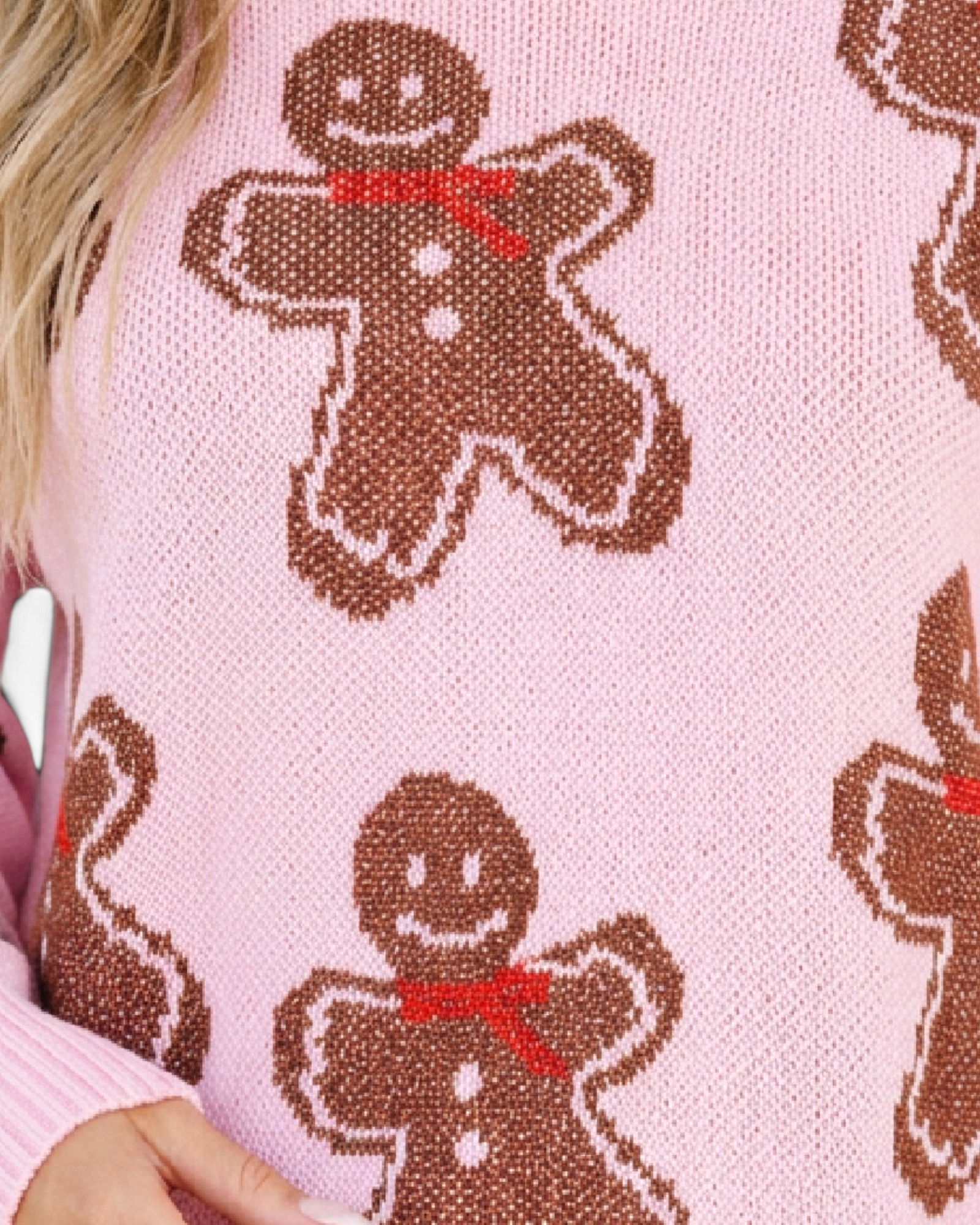 Beach Rose Co. pink knit crewneck sweater featuring an allover brown gingerbread man pattern with red scarf details.