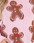 Beach Rose Co. pink knit crewneck sweater featuring an allover brown gingerbread man pattern with red scarf details.