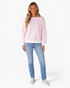 Beach Rose Co. pink and white gingham sweatshirt with balloon sleeves and white ribbed trim worn with blue jeans