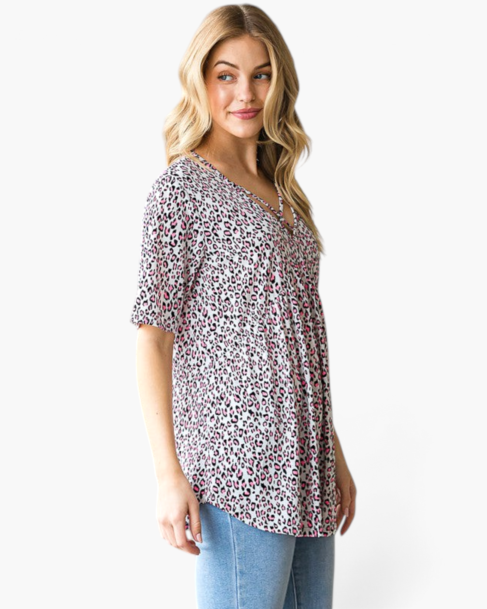 Beach Rose Co. pink leopard print babydoll top with a crisscross V-neckline and short sleeves on a blonde model