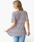 Beach Rose Co. pink leopard print babydoll top with short sleeves and a relaxed fit, viewed from the back