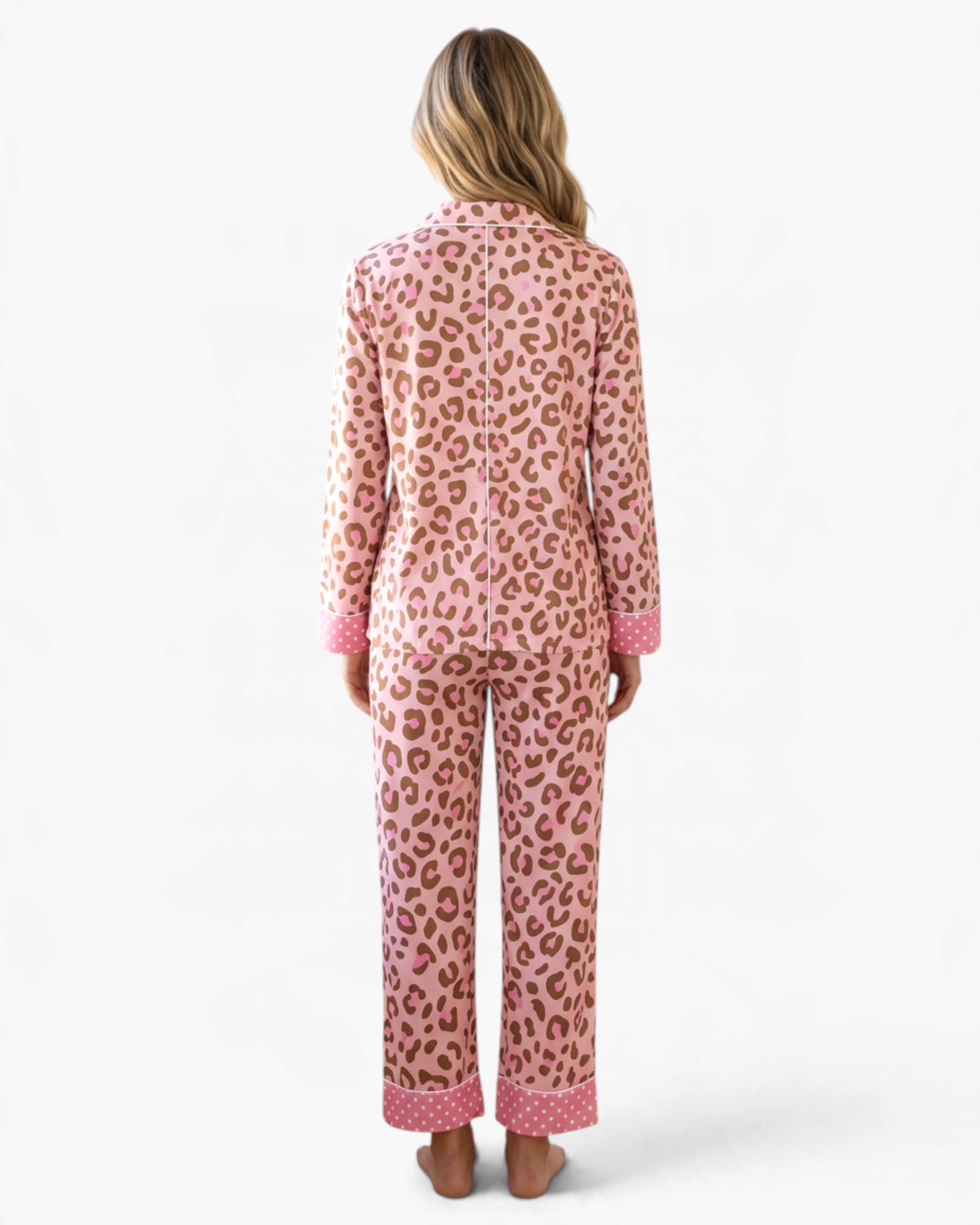 Beach Rose Co. pink leopard print pajama set with polka dot cuffs and contrasting piping, back view on a model