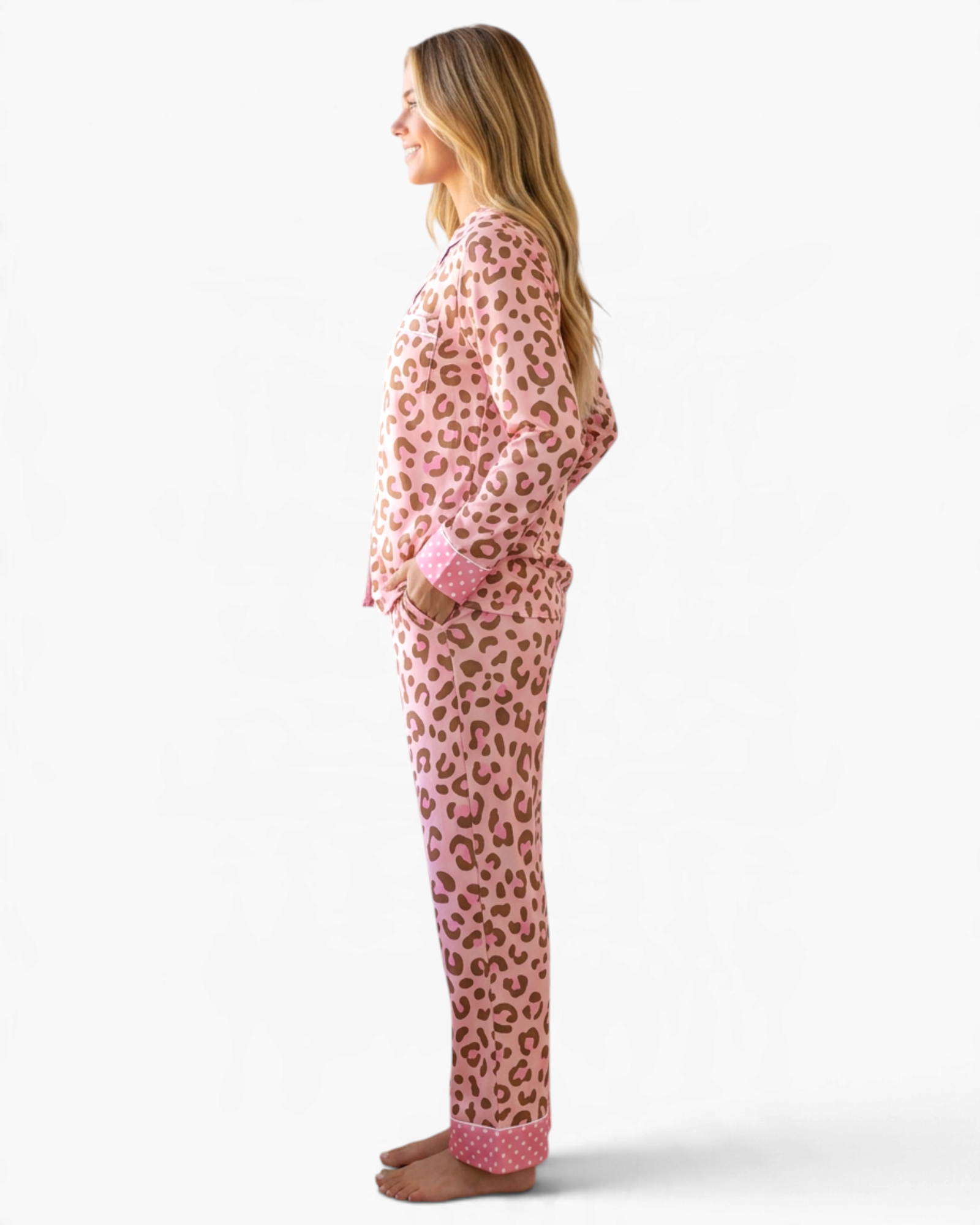 Beach Rose Co. pink leopard print pajama set with polka dot cuffs and piping worn by a woman in profile view