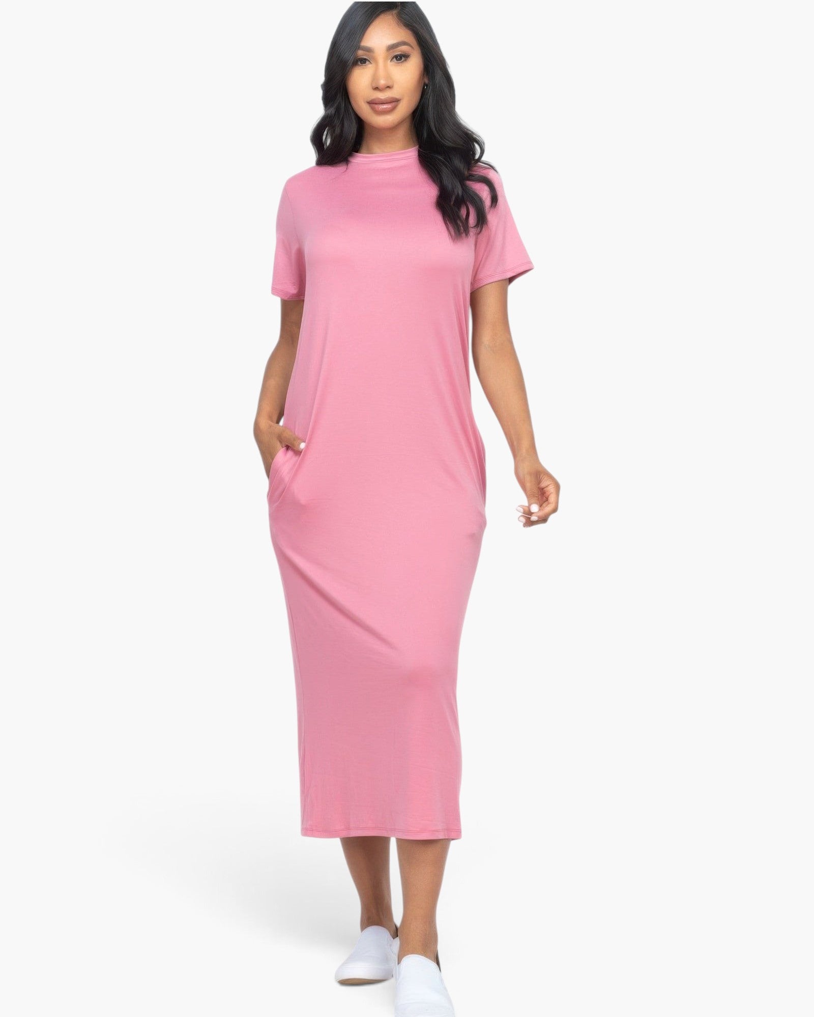 Beach Rose Co. pink midi tee dress with short sleeves and side pockets worn by a model with white slip-on shoes