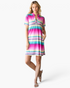 Beach Rose Co. pink multi-stripe shift dress with a notched neckline, short sleeves, and side pockets on a model.
