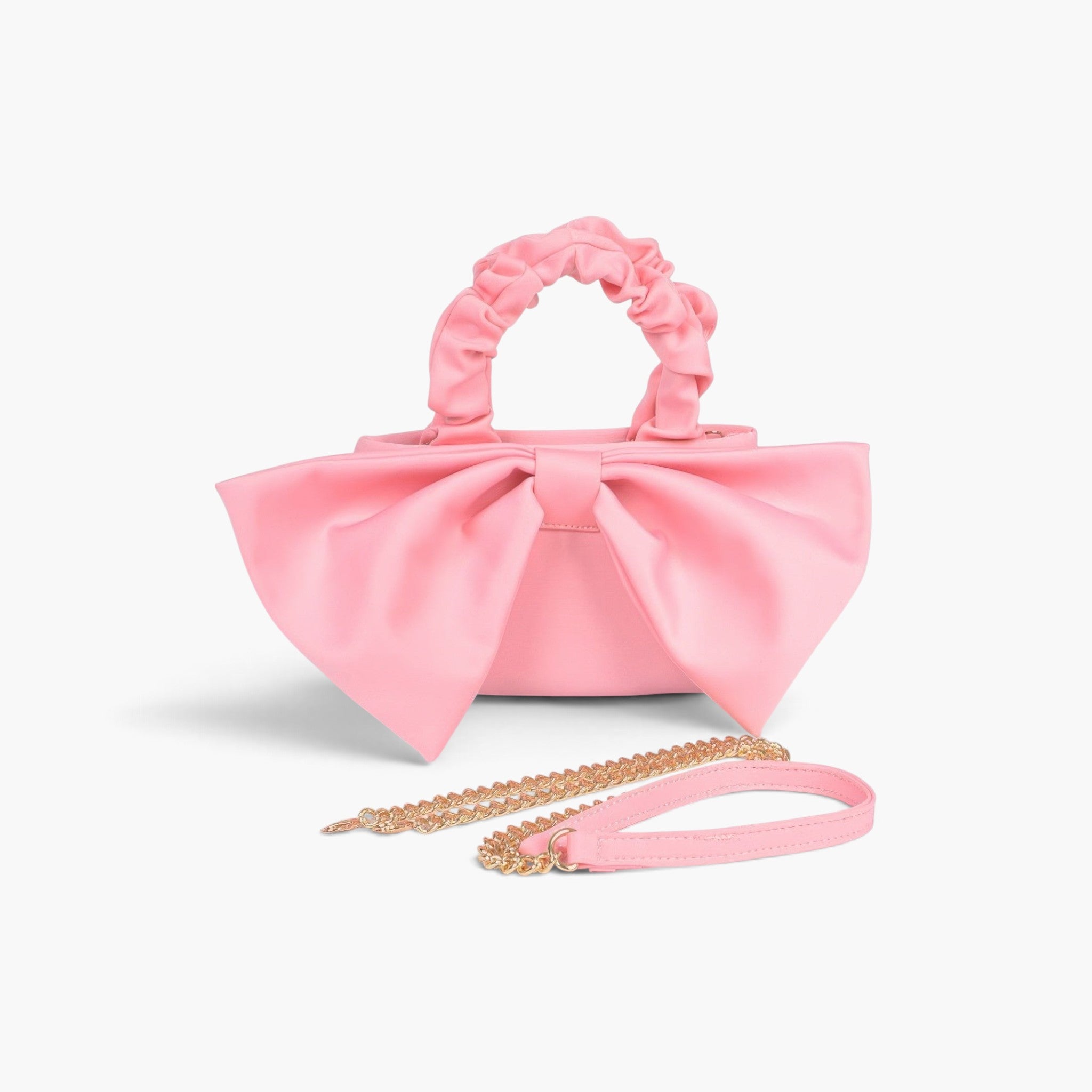 Beach Rose Co. pink nylon clutch with a large front bow, ruched top handle, and detachable gold chain strap.