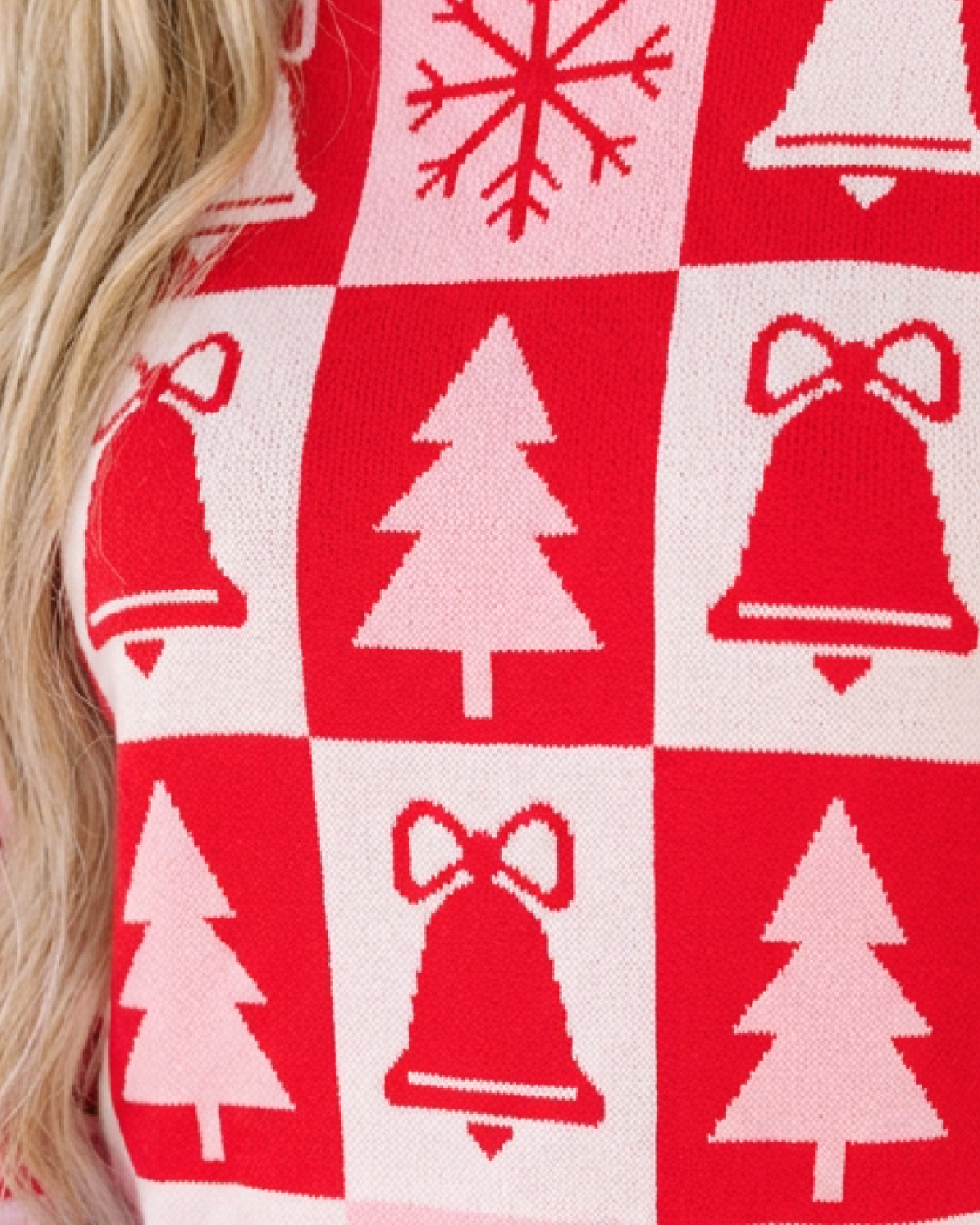 Beach Rose Co. pink and red Christmas checkerboard crewneck sweater featuring tree, bell, and snowflake motifs.