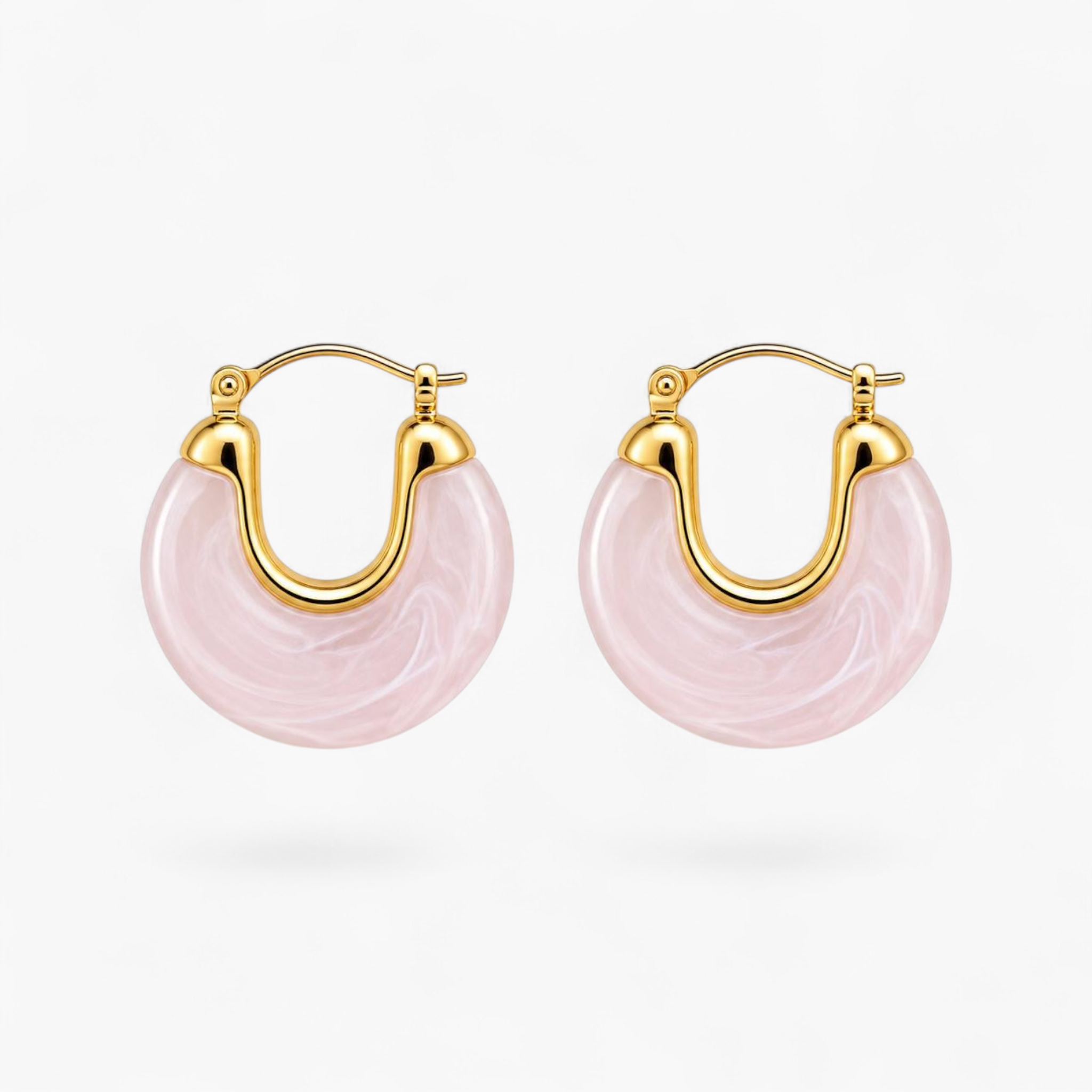 Beach Rose Co. marbled pink resin hoop earrings with 18K gold filled polished metal frames and hinged closures.