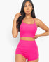 Beach Rose Co. berry pink ribbed cami crop top and matching ruched shorts set worn by a model.