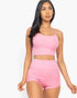 Beach Rose Co. pink ribbed cami crop top and matching ruched shorts set worn by a model against a white background