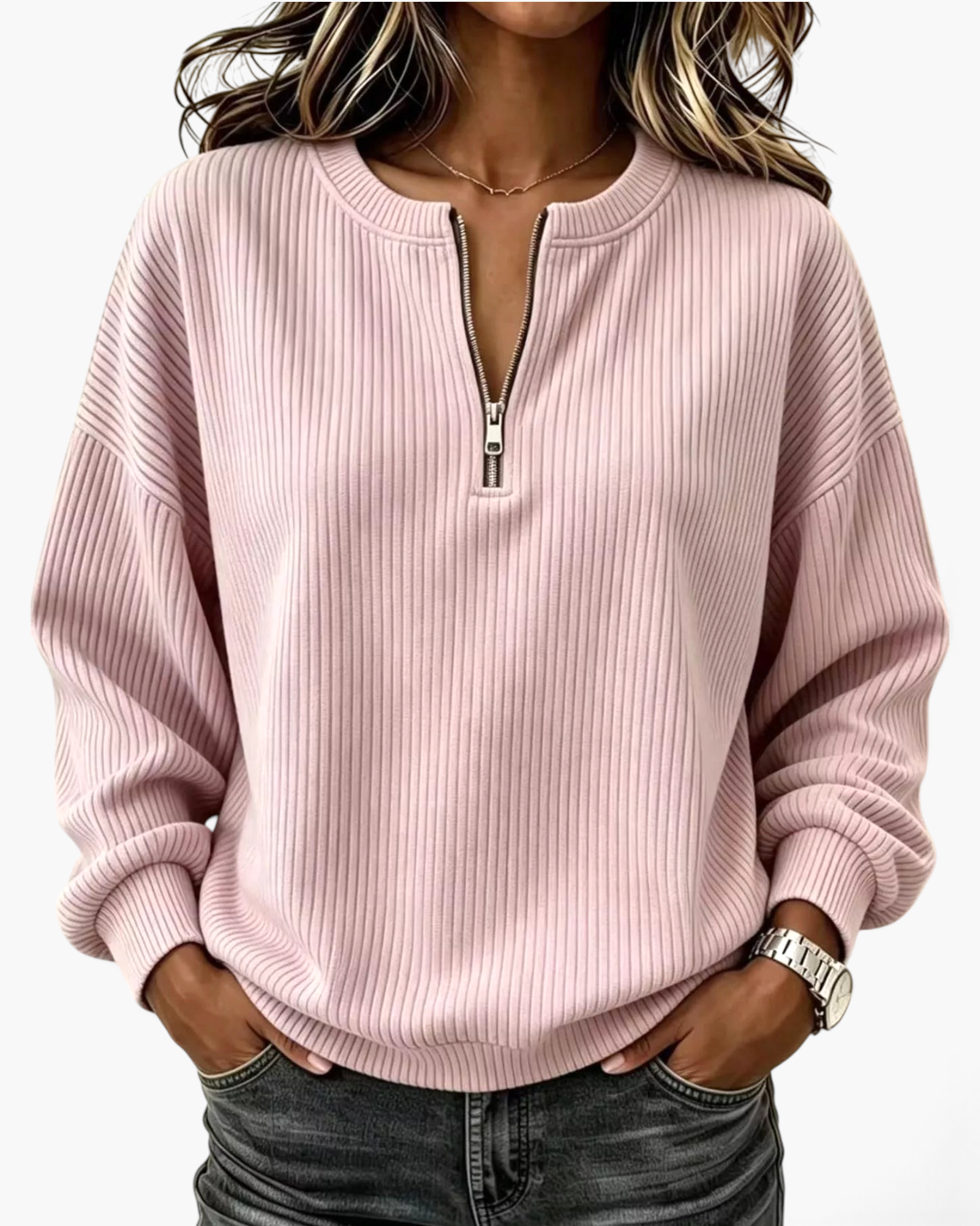 Beach Rose Co. light pink ribbed quarter-zip pullover with dropped shoulders and banded cuffs worn with dark jeans.
