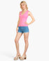 Beach Rose Co. pink ribbed V-neck sleeveless jersey top worn by a blonde model with denim shorts and platform mules