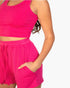 Beach Rose Co. hot pink ribbed two-piece set with a cropped scoop-neck tank and drawstring shorts on a model.