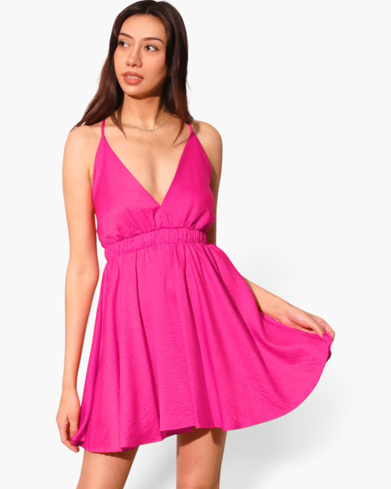 Model wearing a bright pink Beach Rose Co. washed satin crepe cami skater dress with a flattering flared silhouette.
