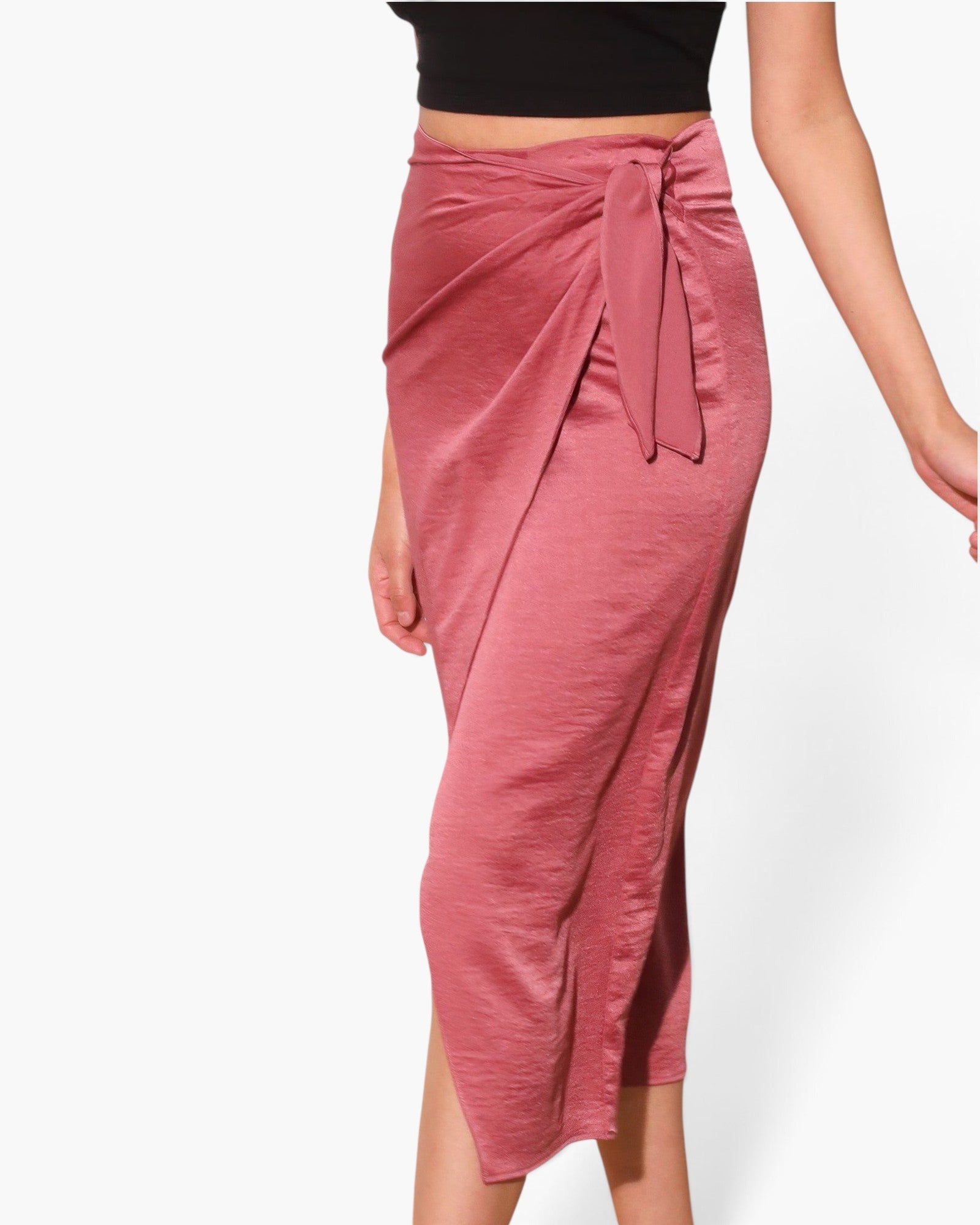 Beach Rose Co. pink washed satin crepe midi skirt with a side wrap tie closure worn with a black crop top