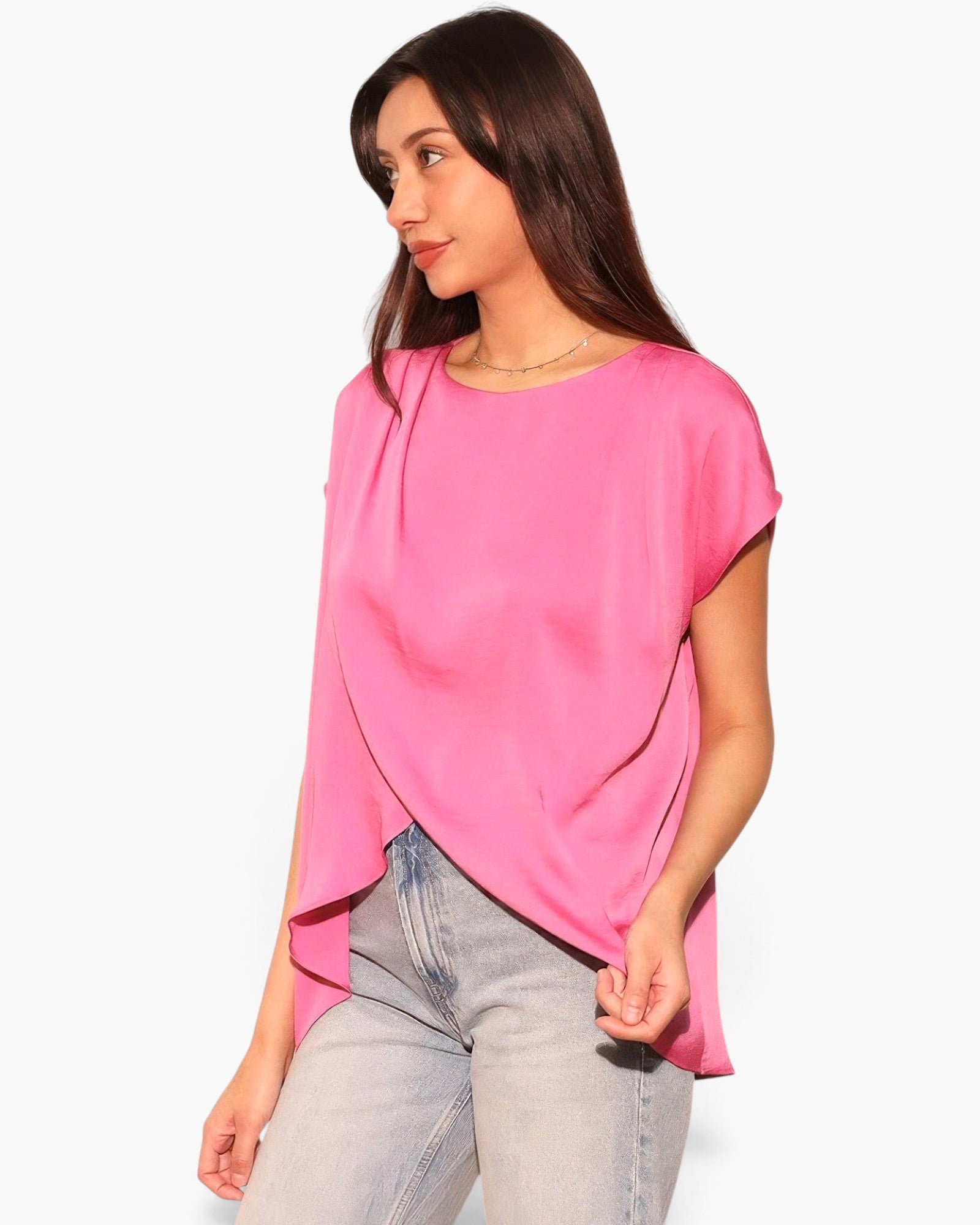 Beach Rose Co. pink washed poly silk tunic top with a tulip hemline worn by a model with light wash jeans