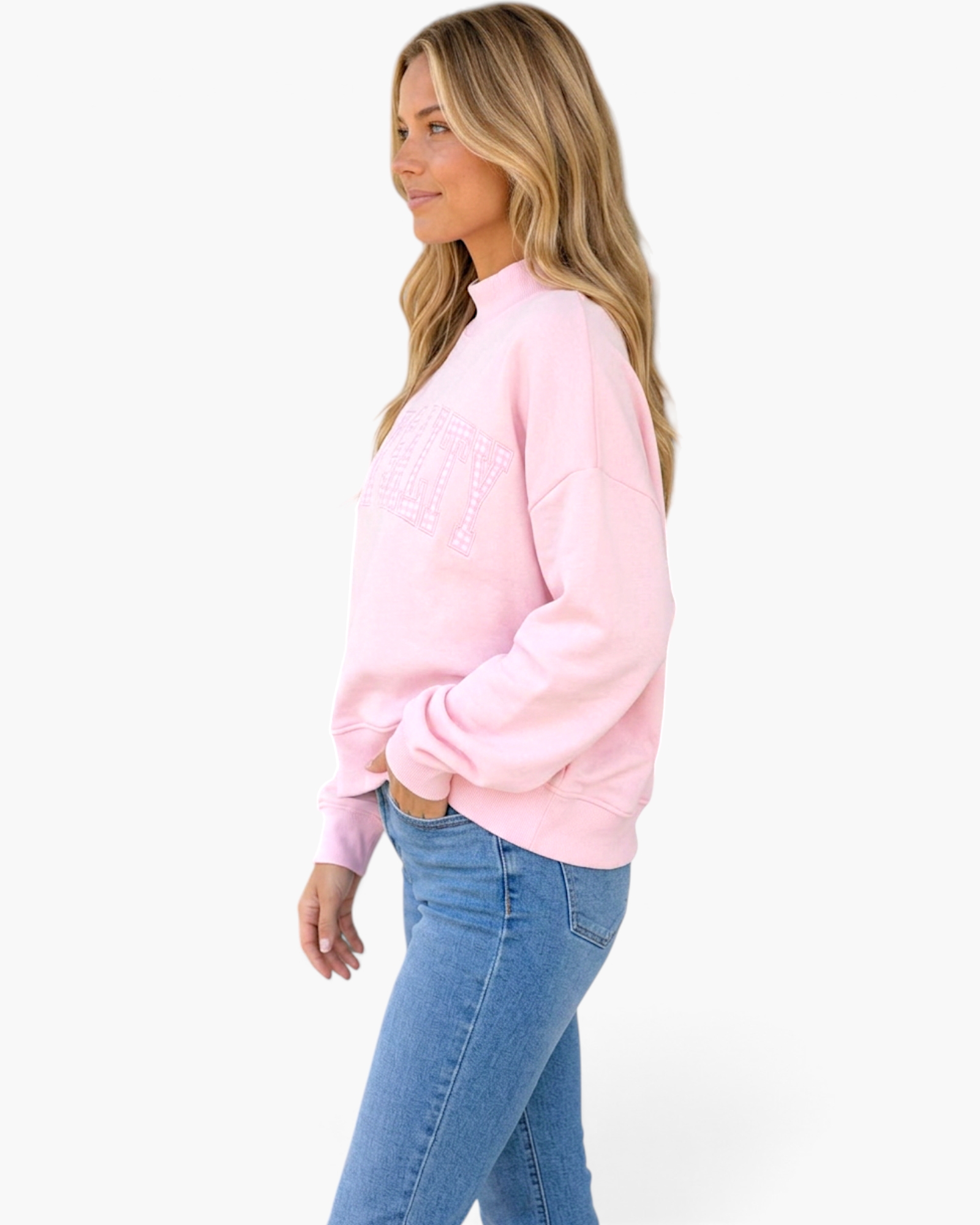 Beach Rose Co. pink cropped sweatshirt with mock neck and plaid Stay Salty graphic worn by a blonde model