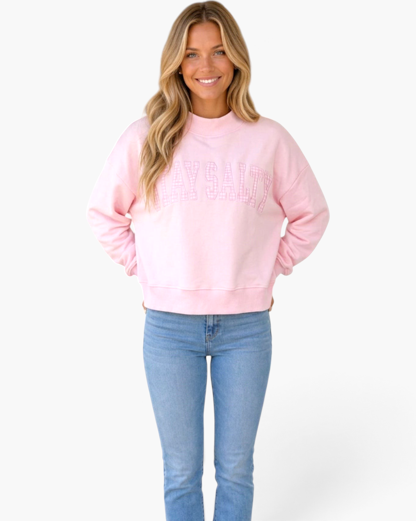 Beach Rose Co. pink cropped sweatshirt with plaid Stay Salty graphic, mock neck, and long sleeves on a smiling model.