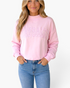 Beach Rose Co. pink cropped sweatshirt with a mock neckline and plaid Stay Salty graphic worn by a blonde model.