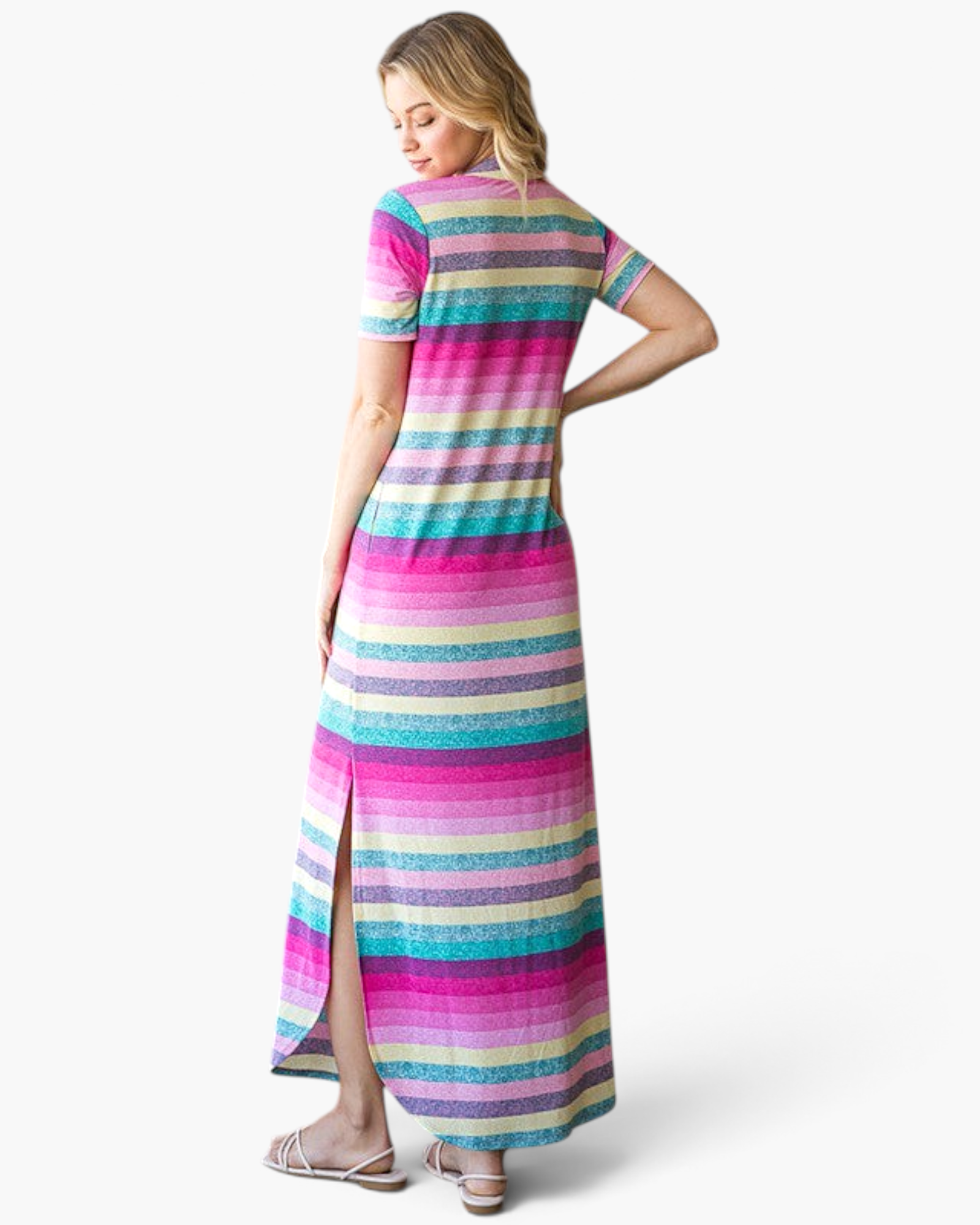 Beach Rose Co. pink multi-stripe maxi dress with short sleeves, side slits, and a relaxed fit on a model, back view.