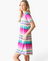 Beach Rose Co. pink multi-stripe shift dress with notched neckline, short sleeves, and side pockets on a model