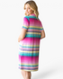 Beach Rose Co. pink multi-stripe shift dress with short sleeves and side pockets, viewed from the back.