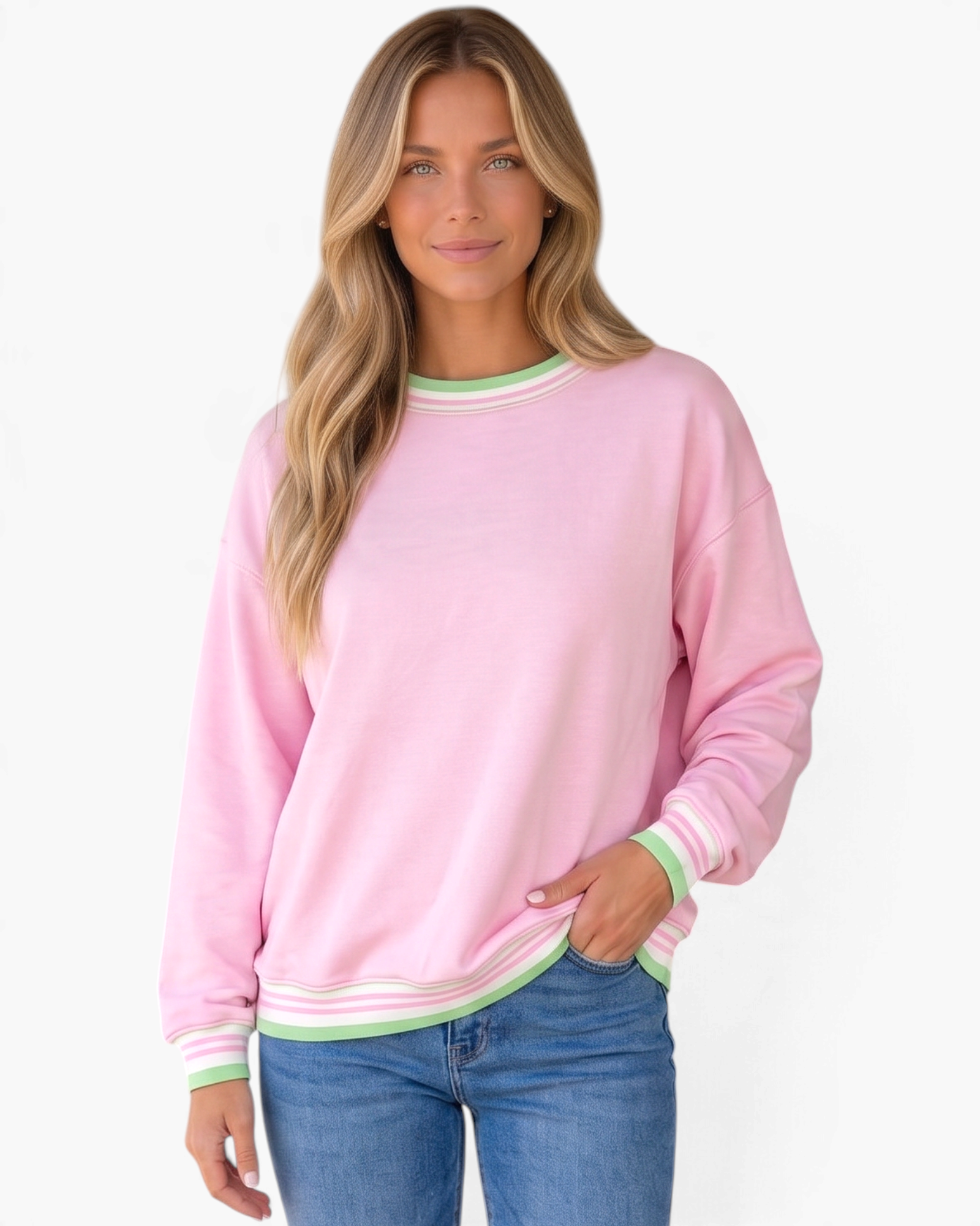 Beach Rose Co. pink crewneck sweatshirt with green and white striped ribbed trim on a model wearing blue jeans.