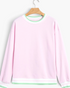 Beach Rose Co. light pink crewneck sweatshirt with green and white striped trim on the neckline, cuffs, and hem.