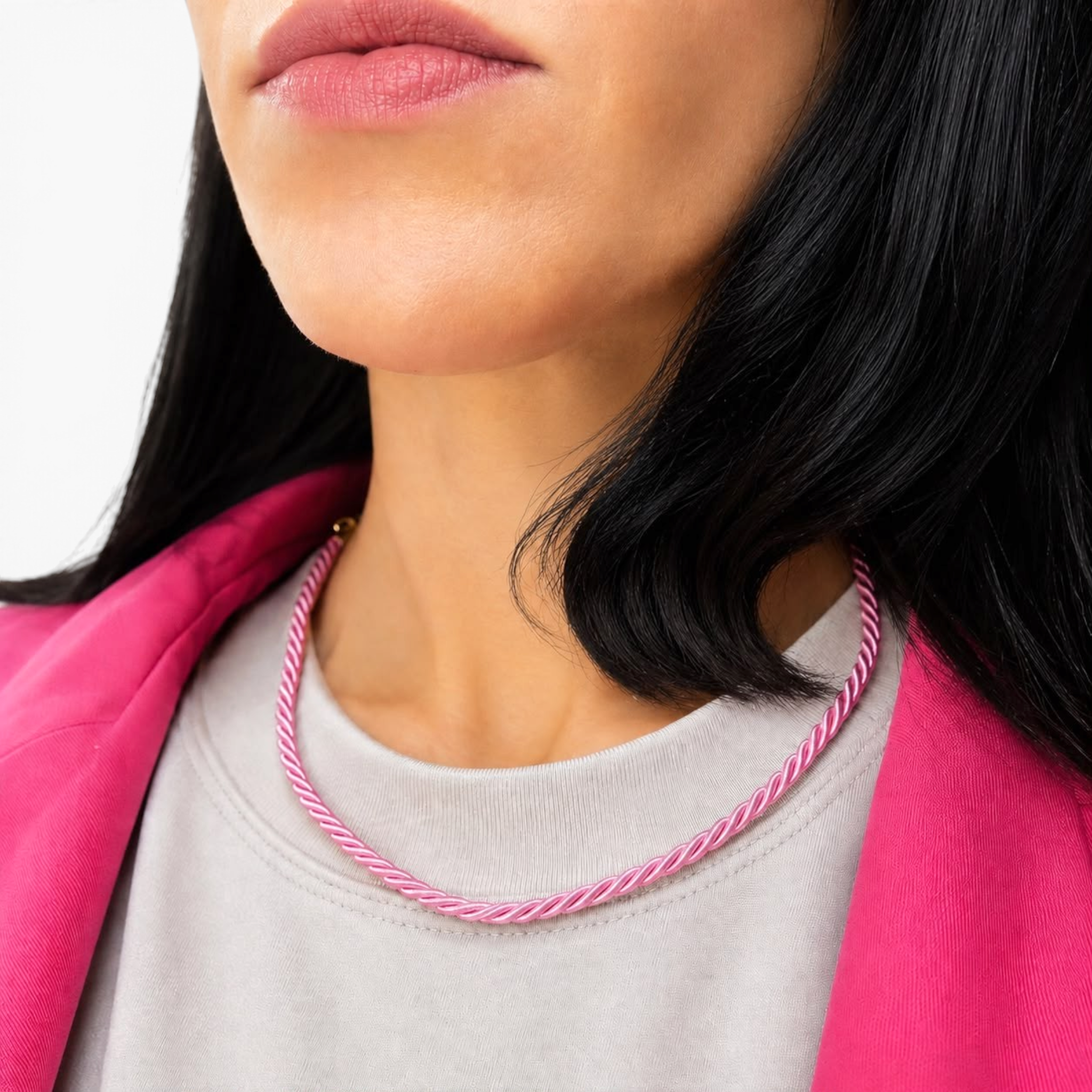 Beach Rose Co. pink twisted cord necklace with 18K gold filled hardware worn around a model's neck