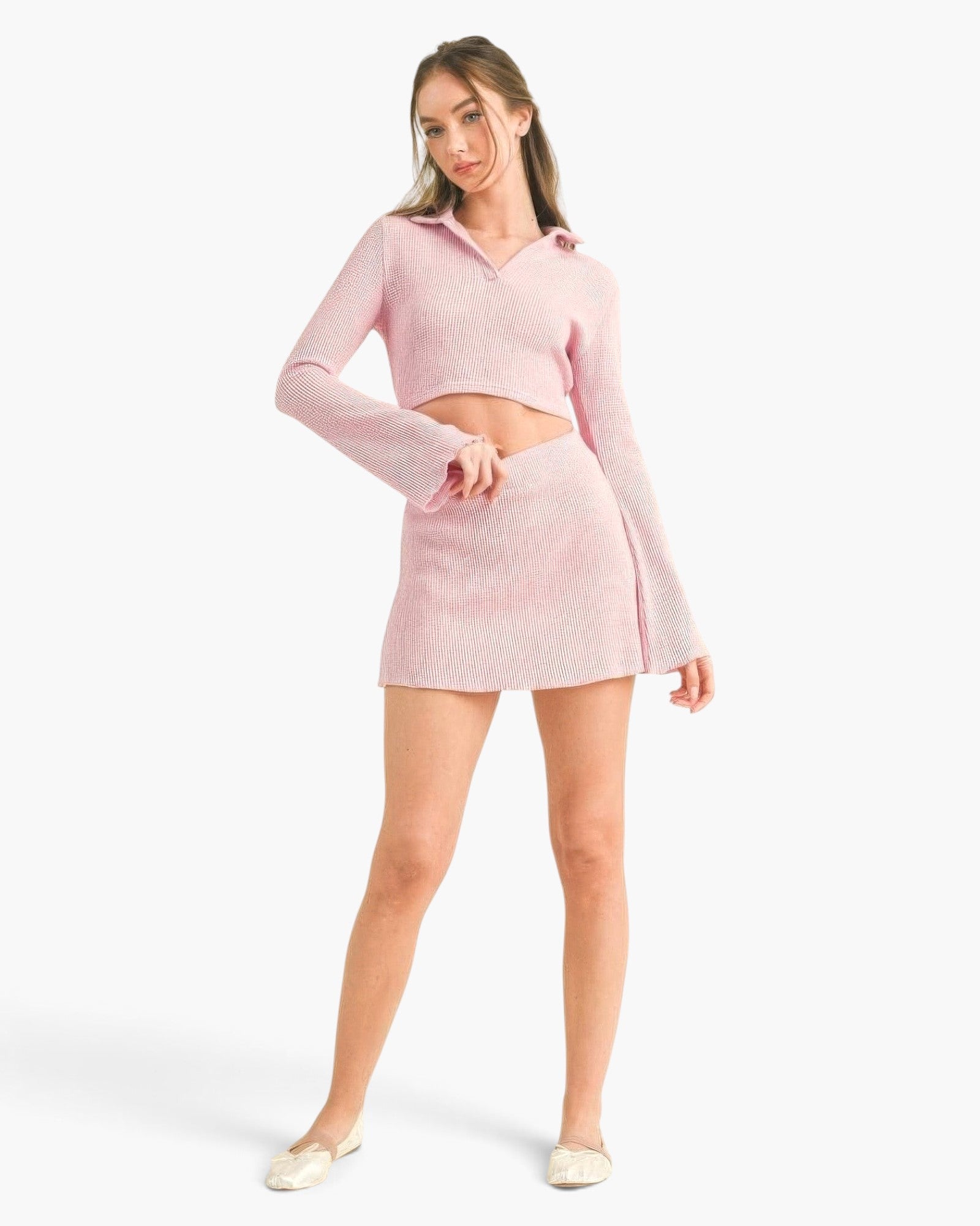 Beach Rose Co. pink waffle knit two-piece set featuring a cropped bell sleeve top and a matching mini skirt on a model