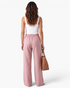 Beach Rose Co. pink wide-leg cotton blend pants with an elastic back waistband, viewed from the back.
