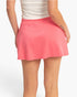 Beach Rose Co. pink A-line skort with an elastic waistband and built-in shorts, shown from the back view.