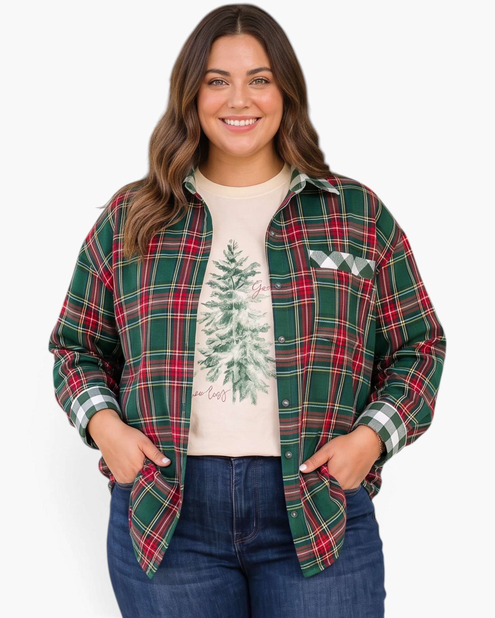 Beach Rose Co. plus size green and red plaid shirt with gingham trim worn open over a graphic tee and jeans.
