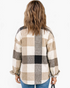 Beach Rose Co. taupe and cream plaid shacket with dropped shoulders and curved hem viewed from the back