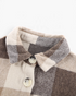 Beach Rose Co. taupe and cream plaid shacket featuring a classic collar and button-front closure