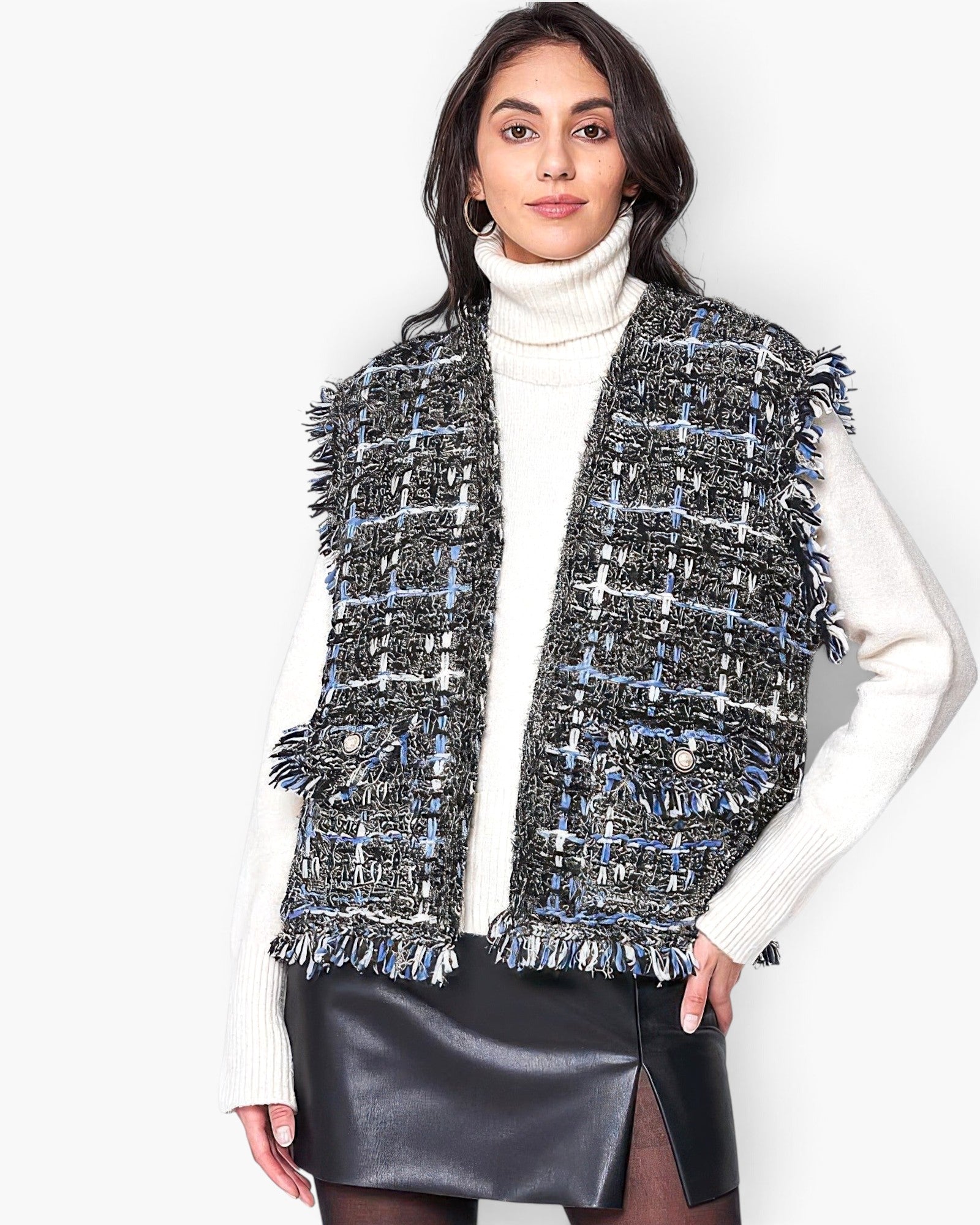 Beach Rose Co. plaid tweed vest with frayed edges and buttoned flap pockets worn over a white turtleneck.