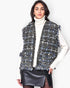 Beach Rose Co. plaid tweed vest with frayed edges and buttoned flap pockets worn over a white turtleneck.