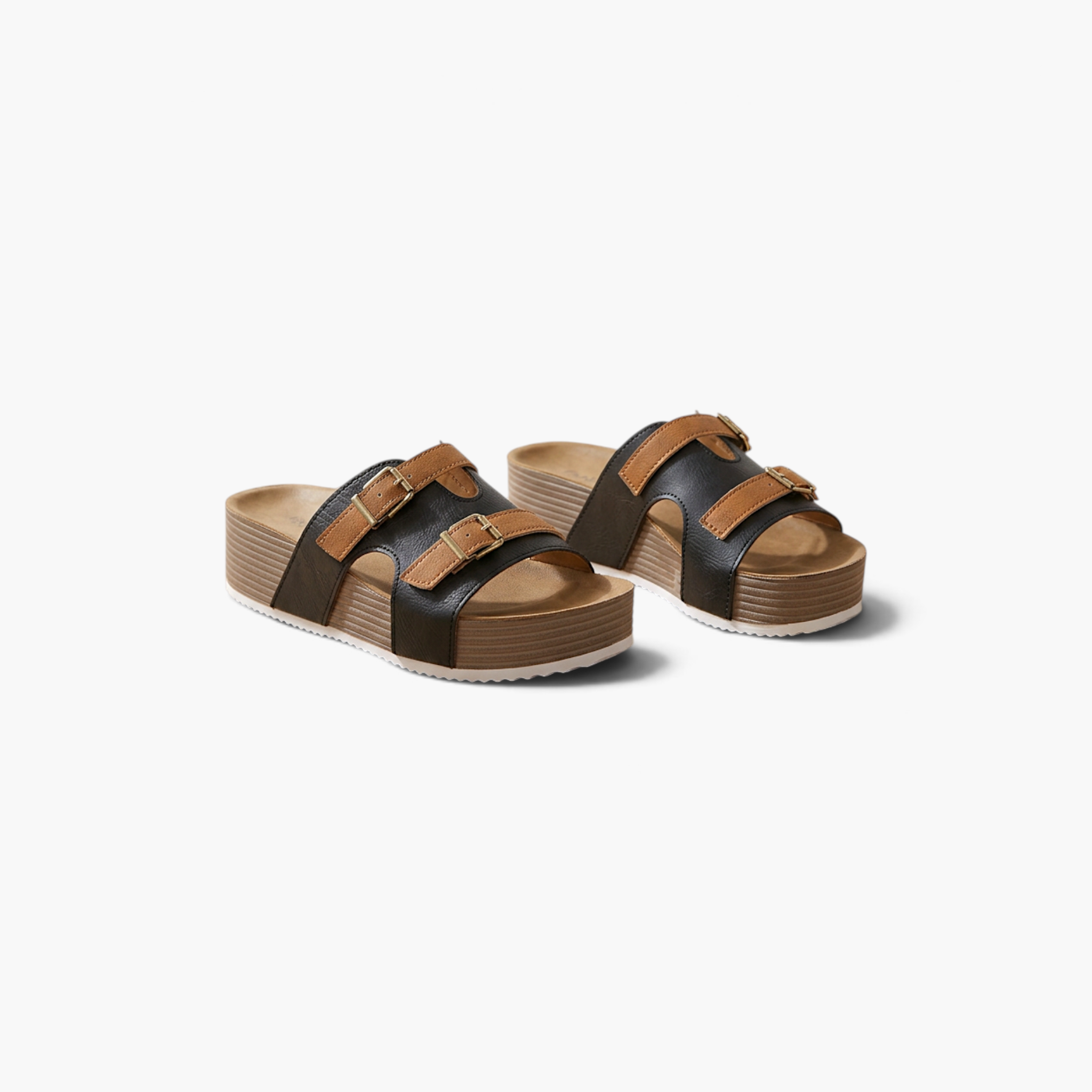 Beach Rose Co. Jenesis retro platform slippers featuring black and tan straps with gold buckles on a thick sole.