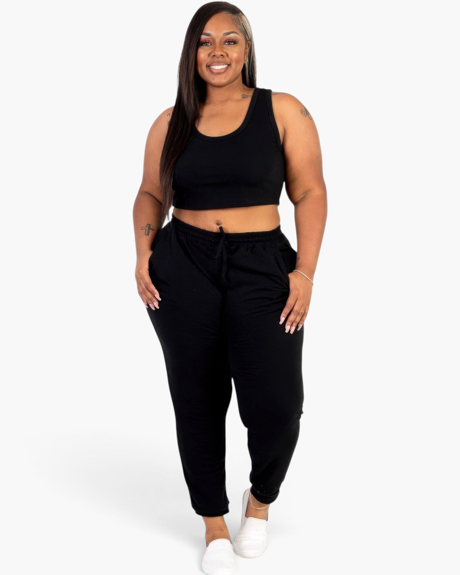 Beach Rose Co. plus size black French terry cropped tank top and joggers set worn by a smiling model