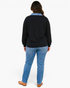 Beach Rose Co. plus size black pullover with denim collar and long sleeves worn by a model from the back view