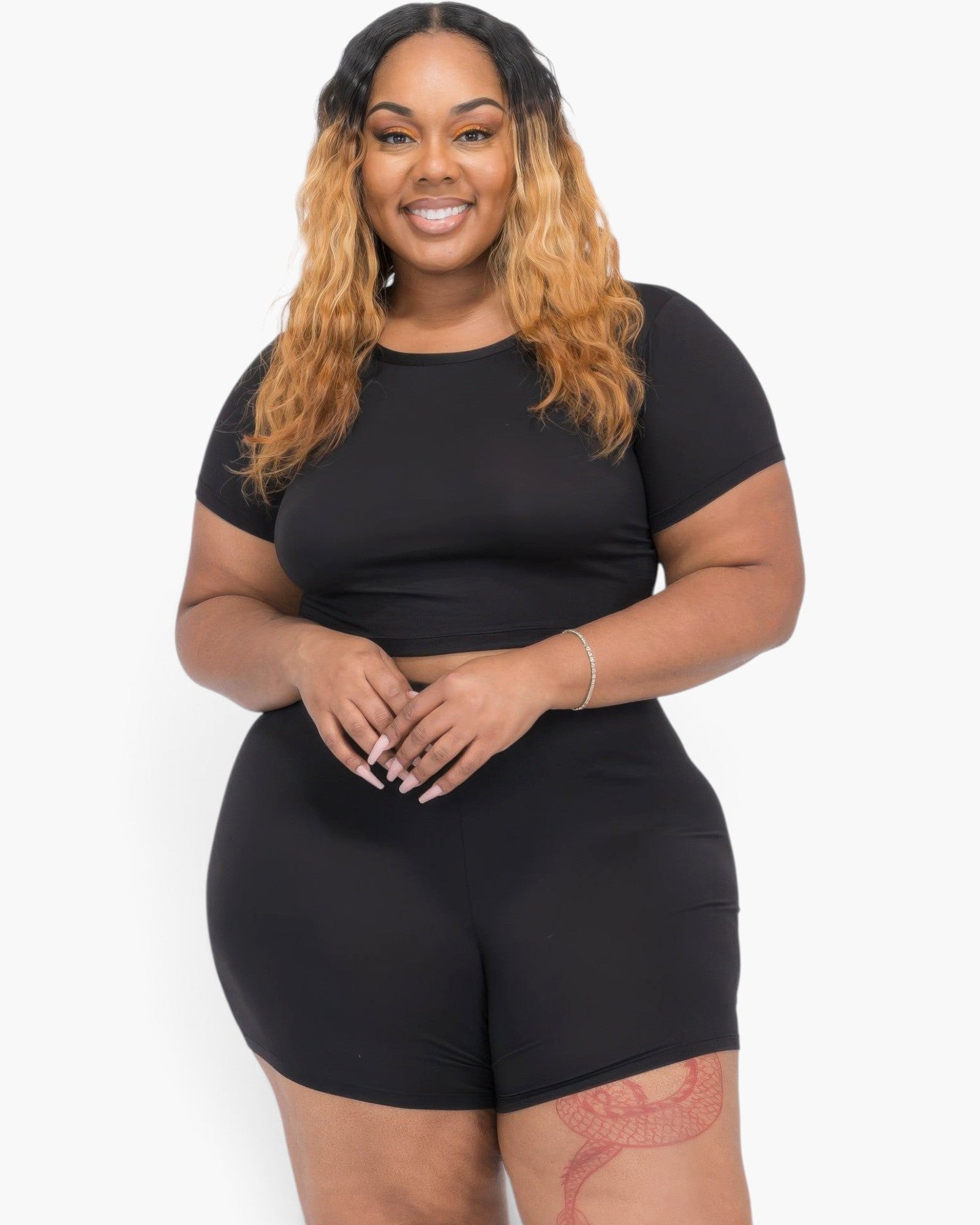Beach Rose Co. plus size model wearing a black short sleeve crop top and matching shorts in soft stretch jersey
