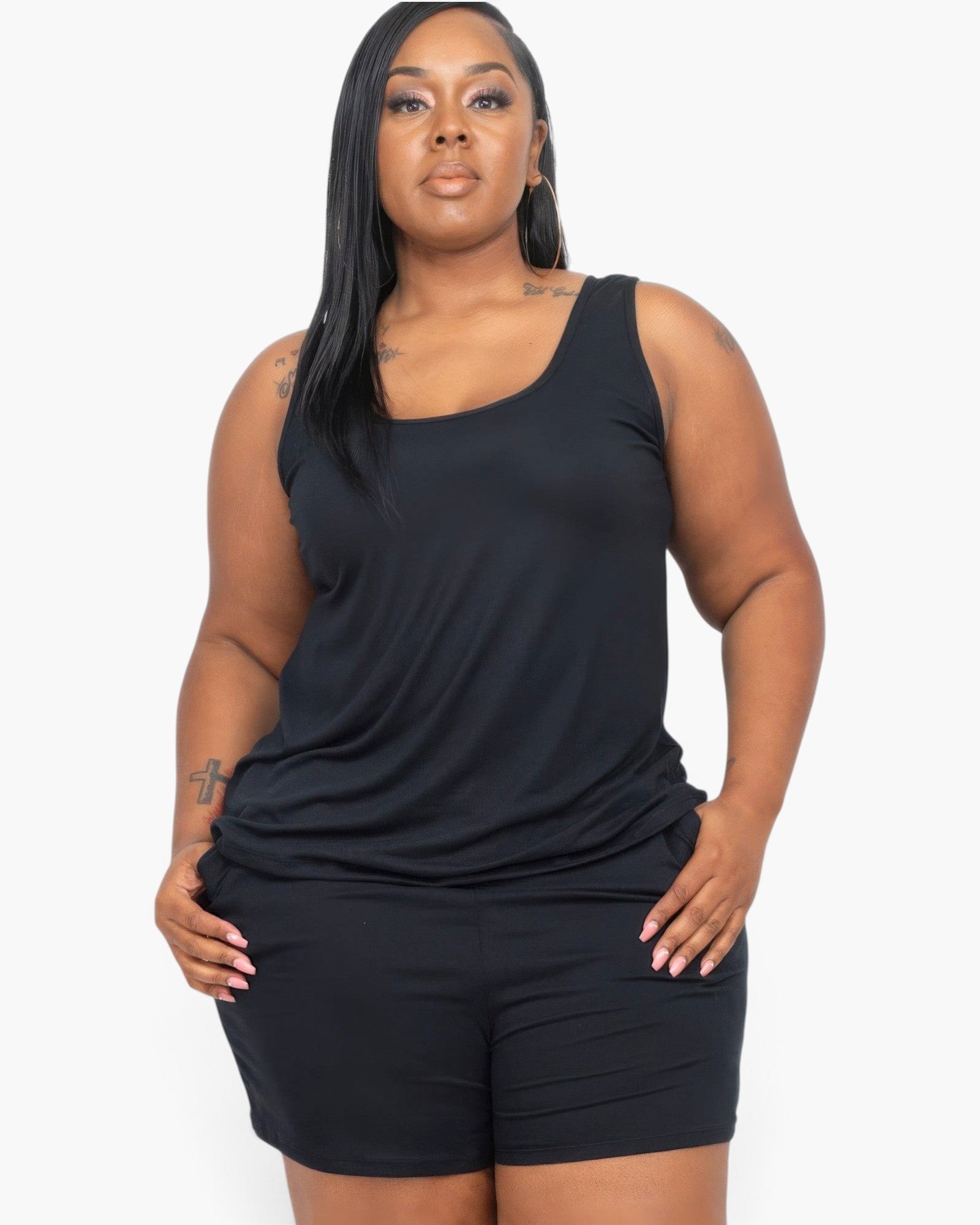 Beach Rose Co. plus size model wearing a black stretchy jersey tank top and matching shorts for a comfortable fit.