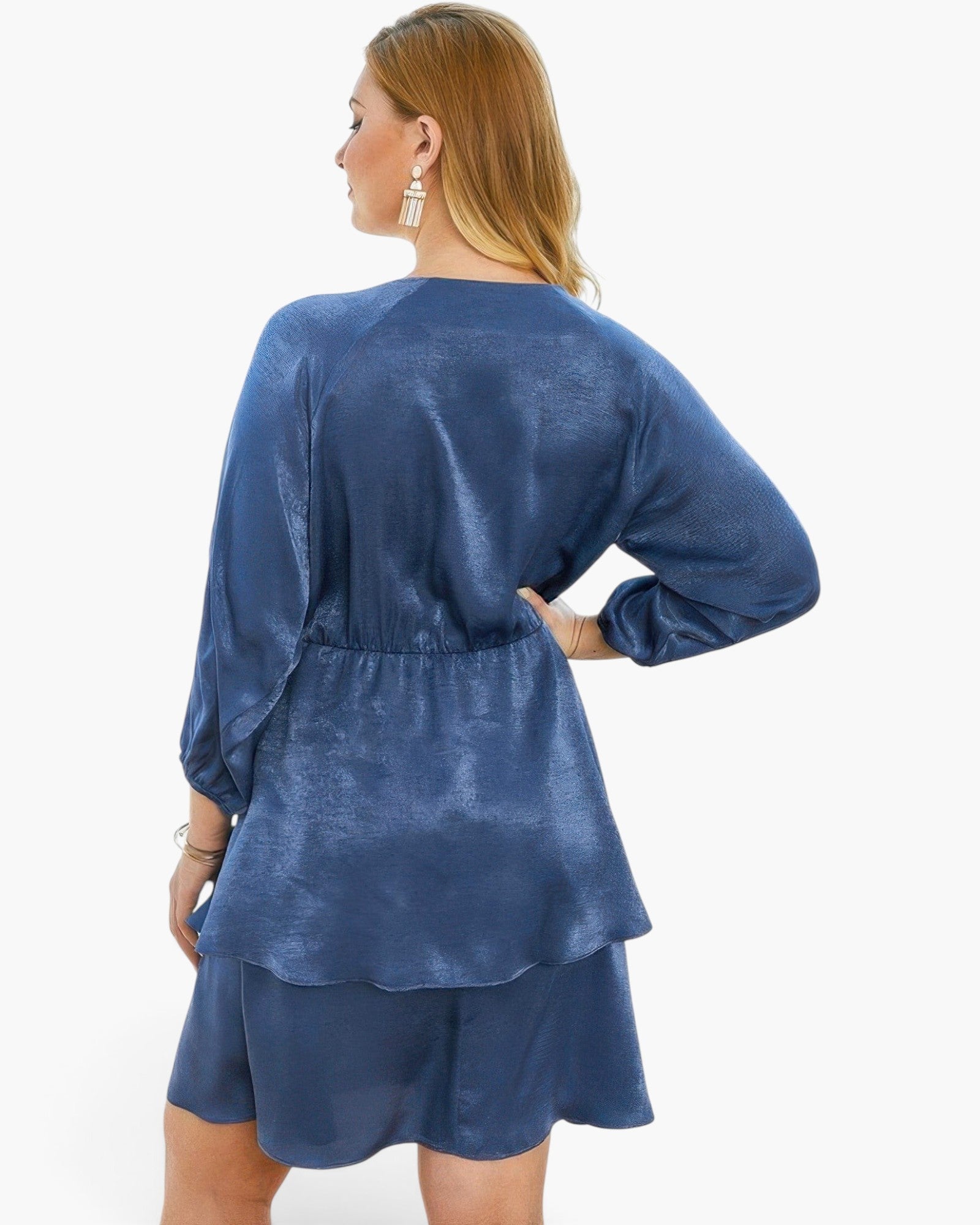 Beach Rose Co. plus size blue V-neck dress with long sleeves and a tiered ruffled hem on a model, back view