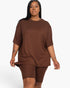 Beach Rose Co. plus size brown loose fit jersey top and matching biker shorts set on a model