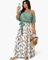 Beach Rose Co. plus size one-shoulder dress with a solid green top and a white skirt featuring a colorful leaf print.