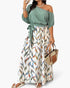 Beach Rose Co. plus size one-shoulder dress with a sage green top and a white skirt featuring a colorful leaf print.