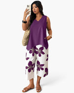 Beach Rose Co. plus size two-piece set featuring a purple sleeveless top and white floral patchwork cropped pants.